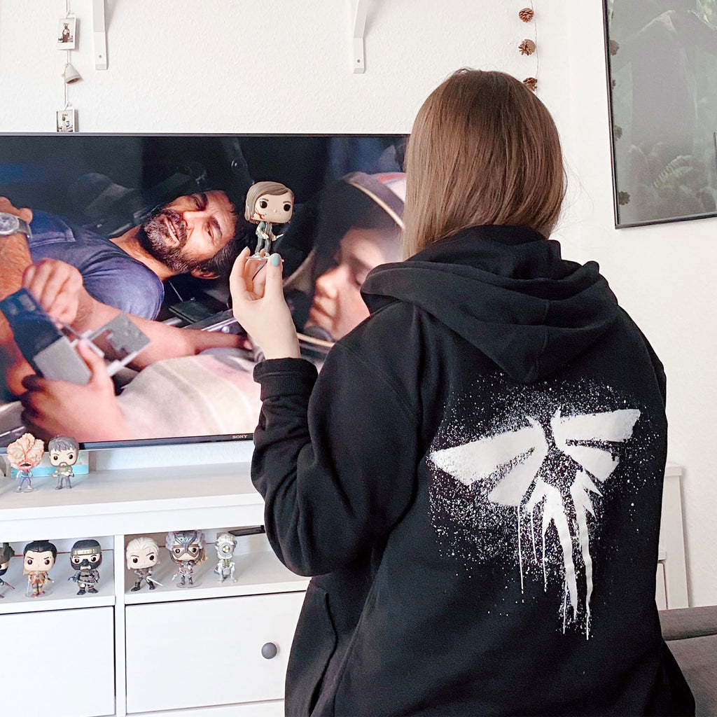 Produktbild The Last of Us - Fireflies Logo huvtröja svart